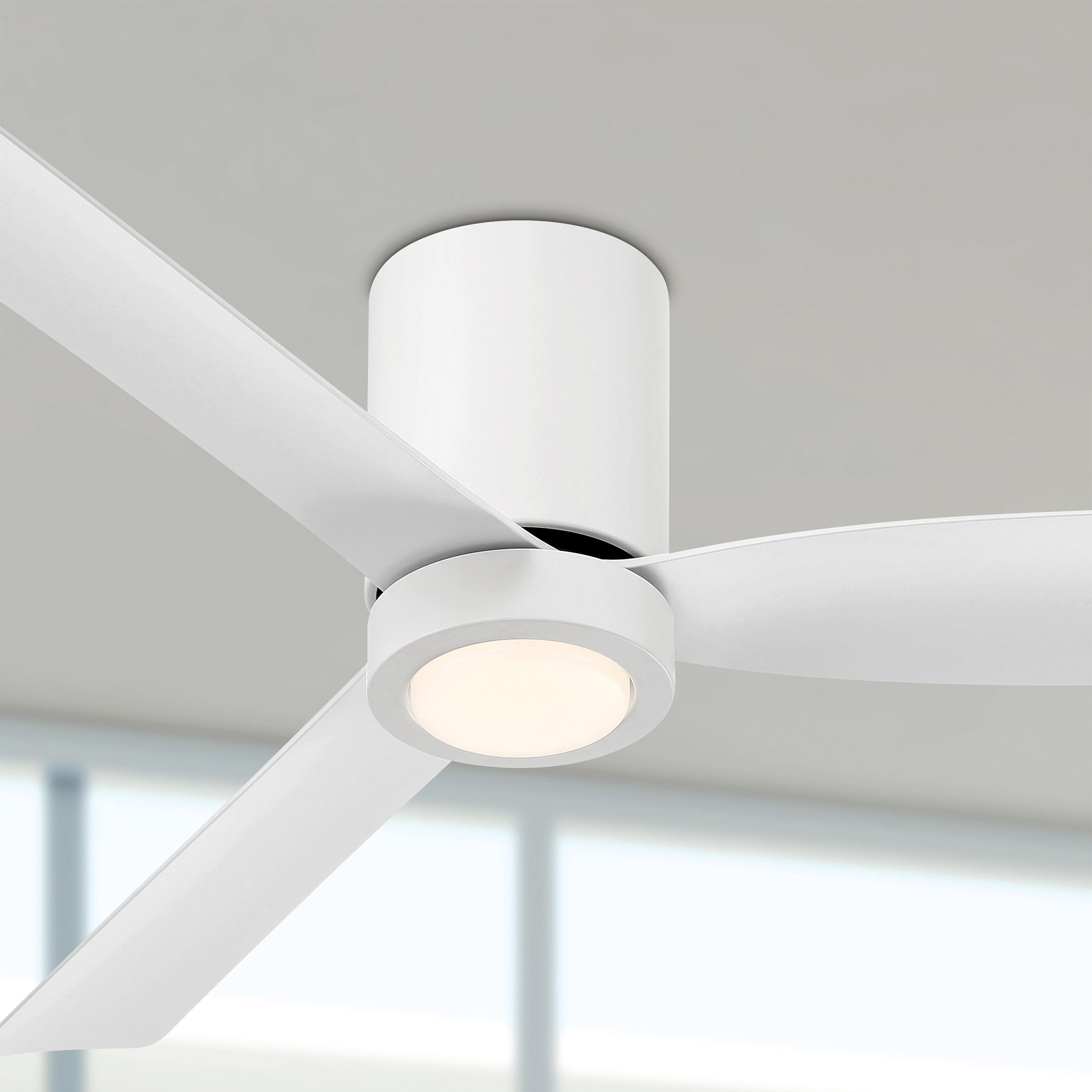 Modern white cormac ceiling fan with light fixture against a neutral background
