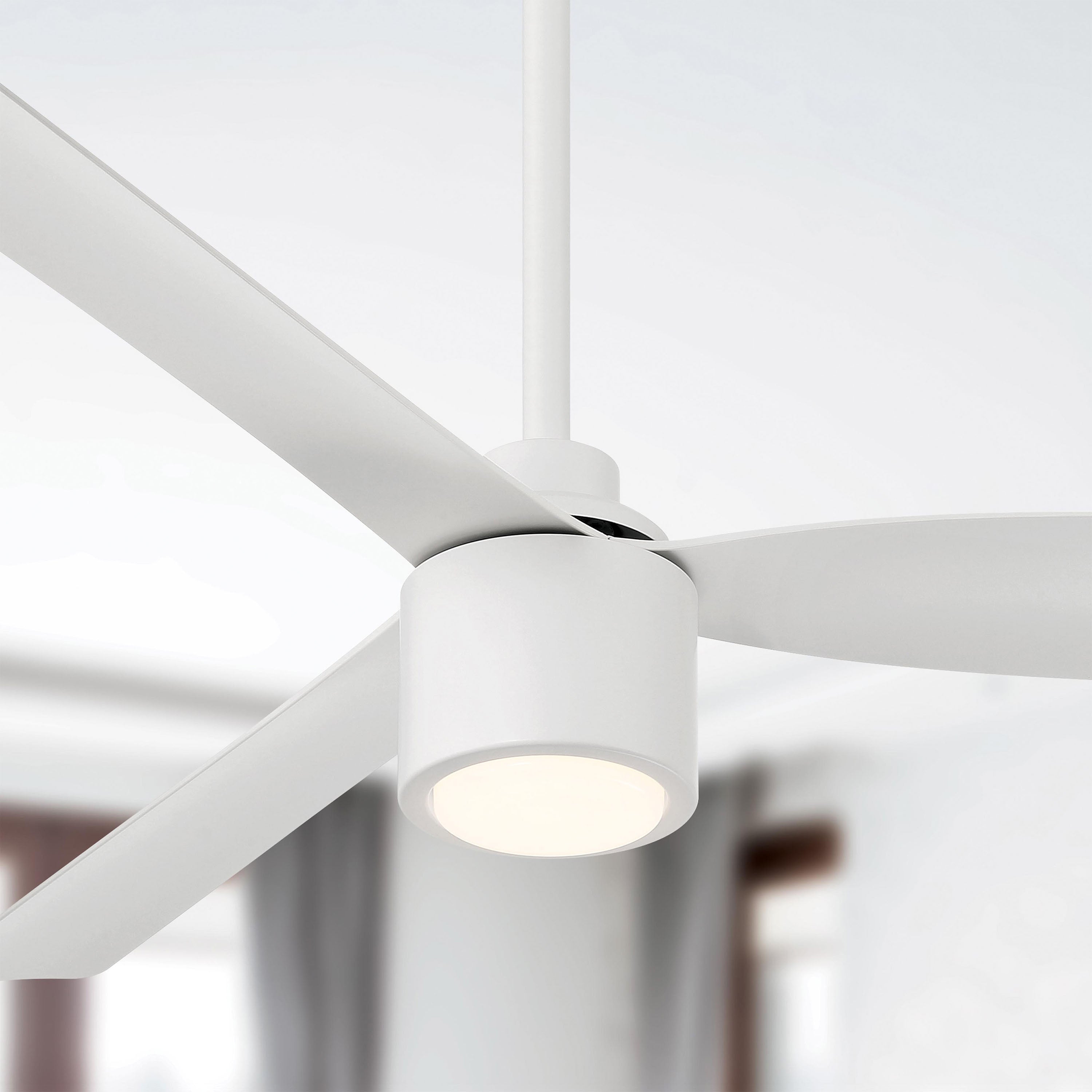 Close-up of Ravian 3-blade modern ceiling fan with light fixture in a room setting featuring matte white finish