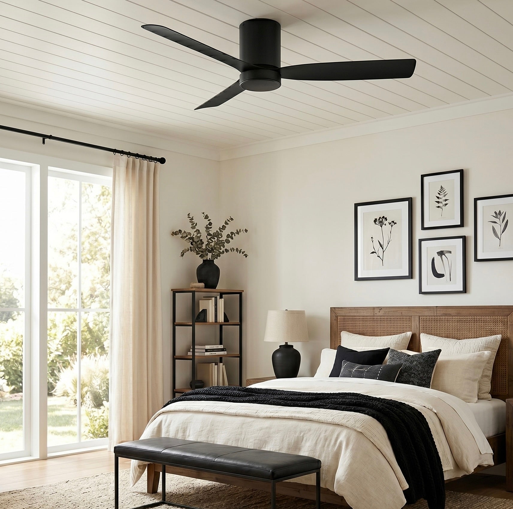 Modern bedroom with a cormac 3 blade ceiling fan, bed, and decor elements.