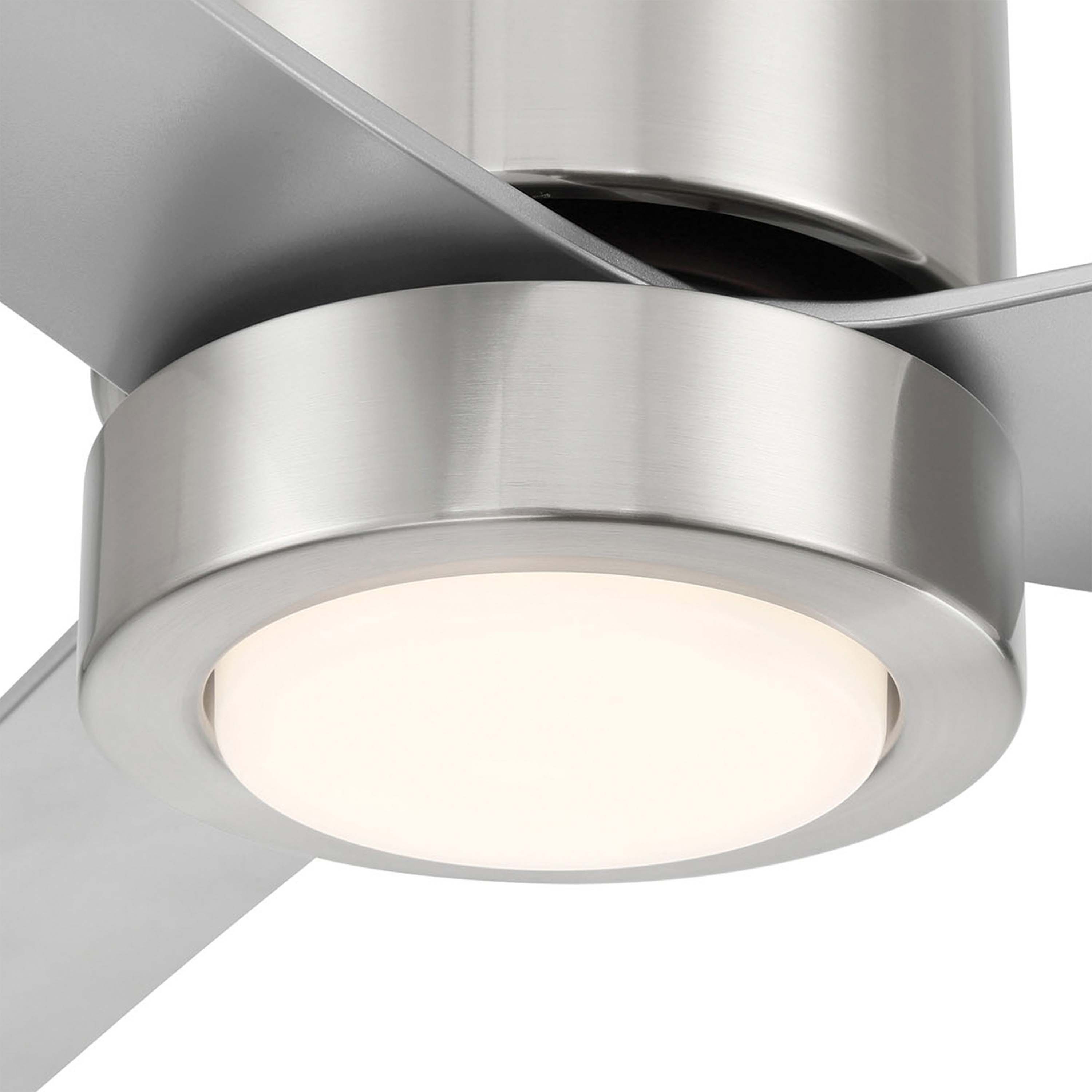 Close-up of a modern ceiling fan with light fixture on a white background