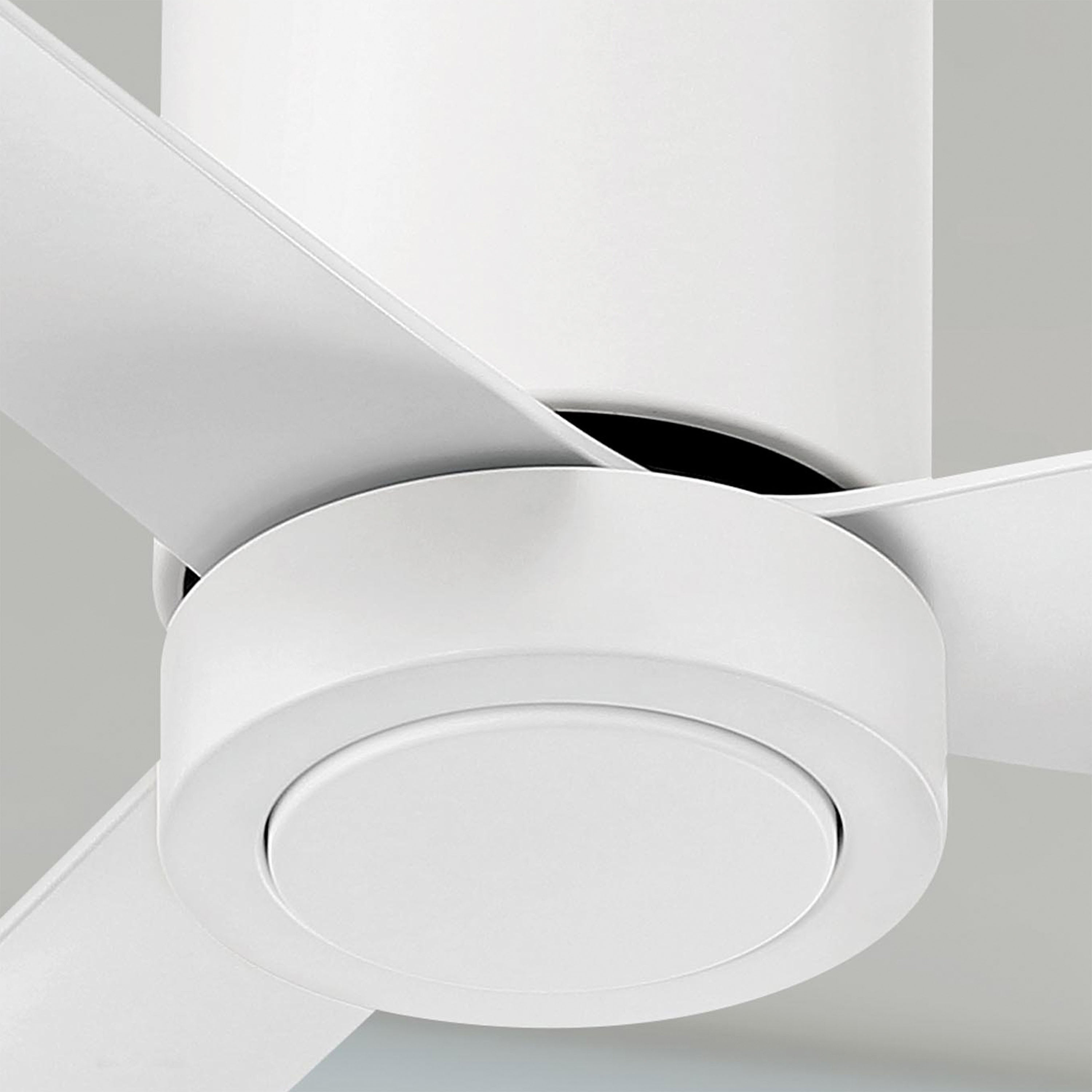 Close-up of a white cormac ceiling fan blade against a neutral background
