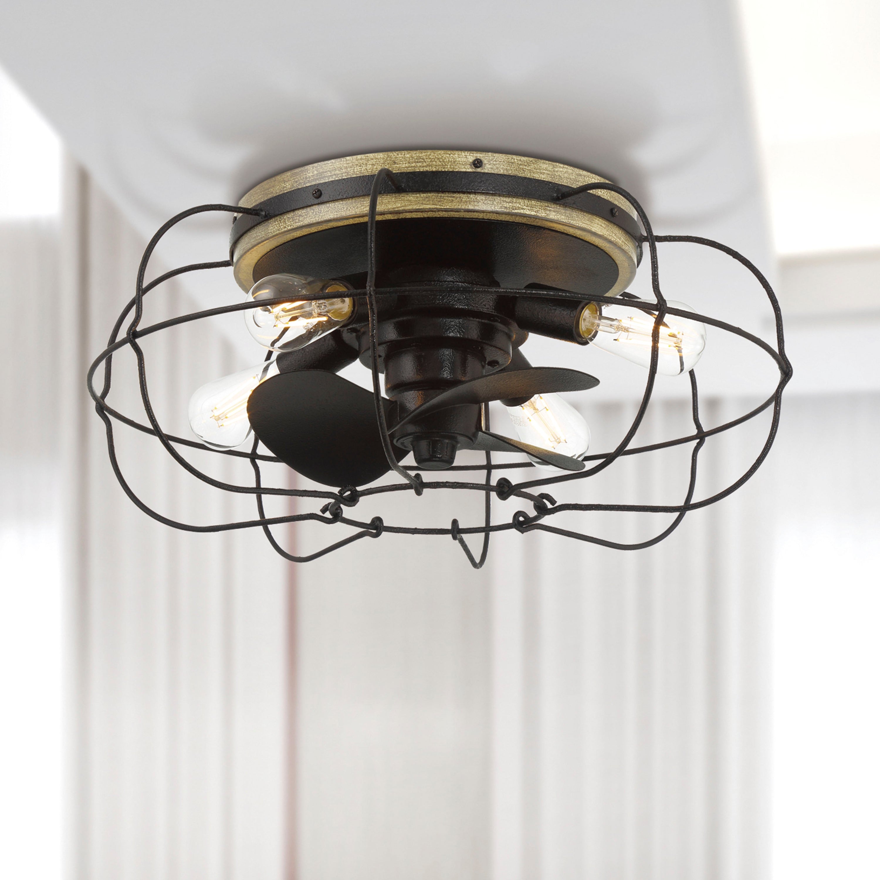 A 22 inch flush mount ceiling fan fandelier with a satin black finish and faux woodgrain accents, featuring a cage design with LED lights and remote