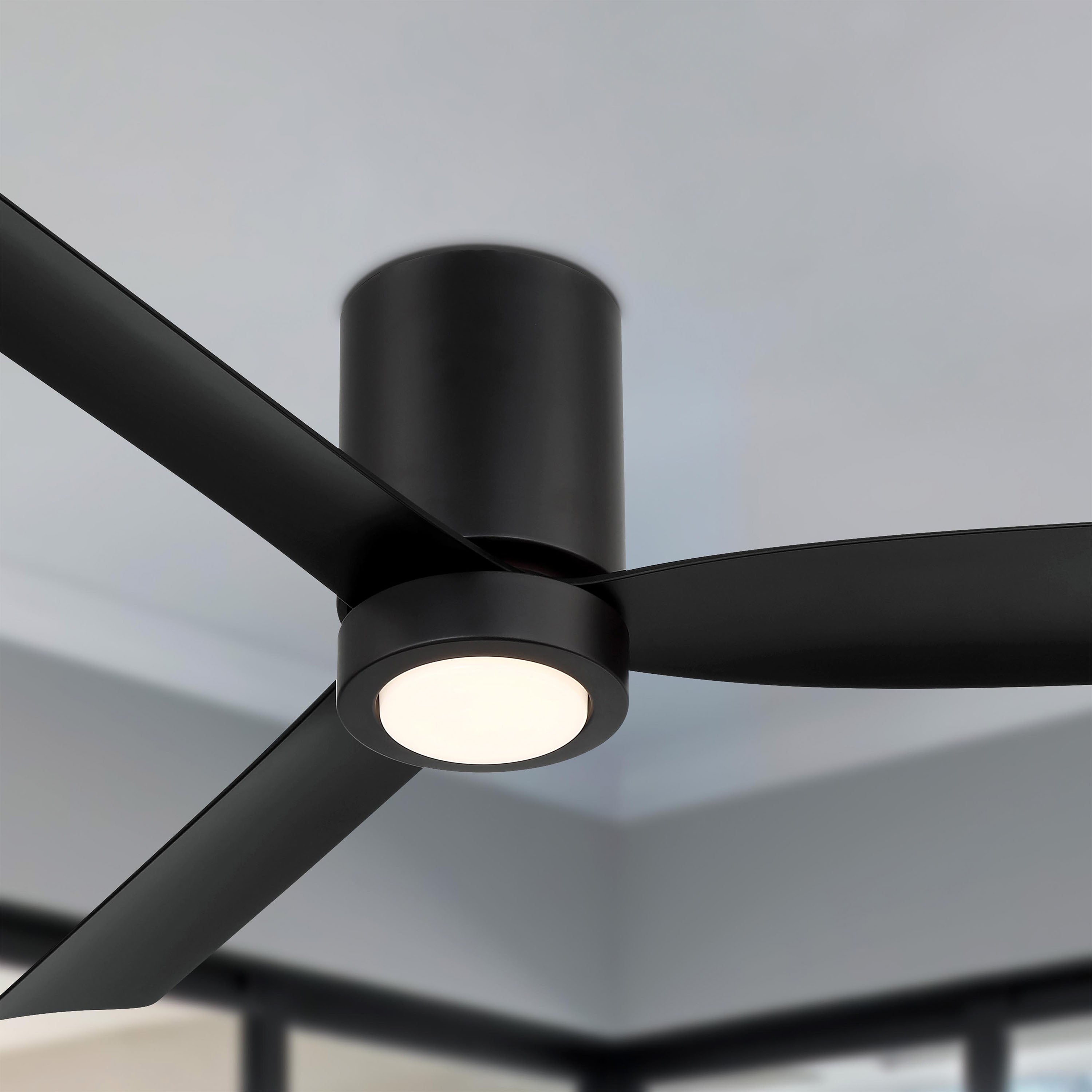 Modern black Cormac ceiling fan with light fixture against a neutral background