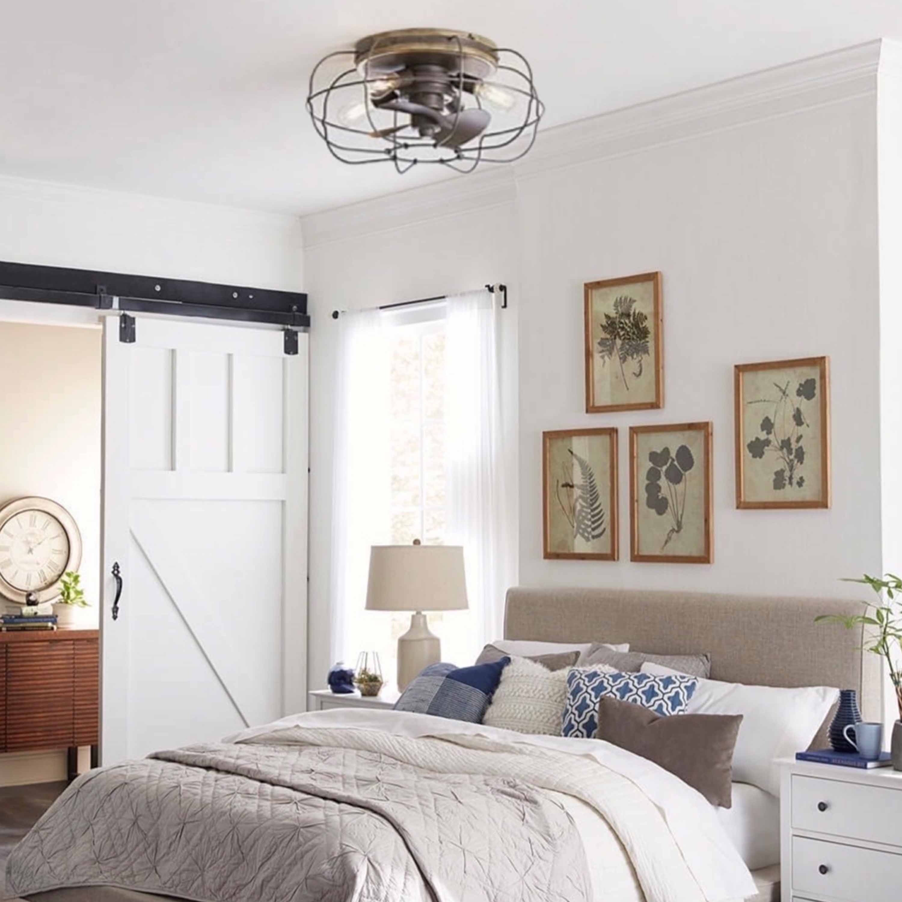 modern farmhouse bedroom featuring JAXON® 22" Flush Mount Caged Ceiling Fan shown in Charred Iron Finish
