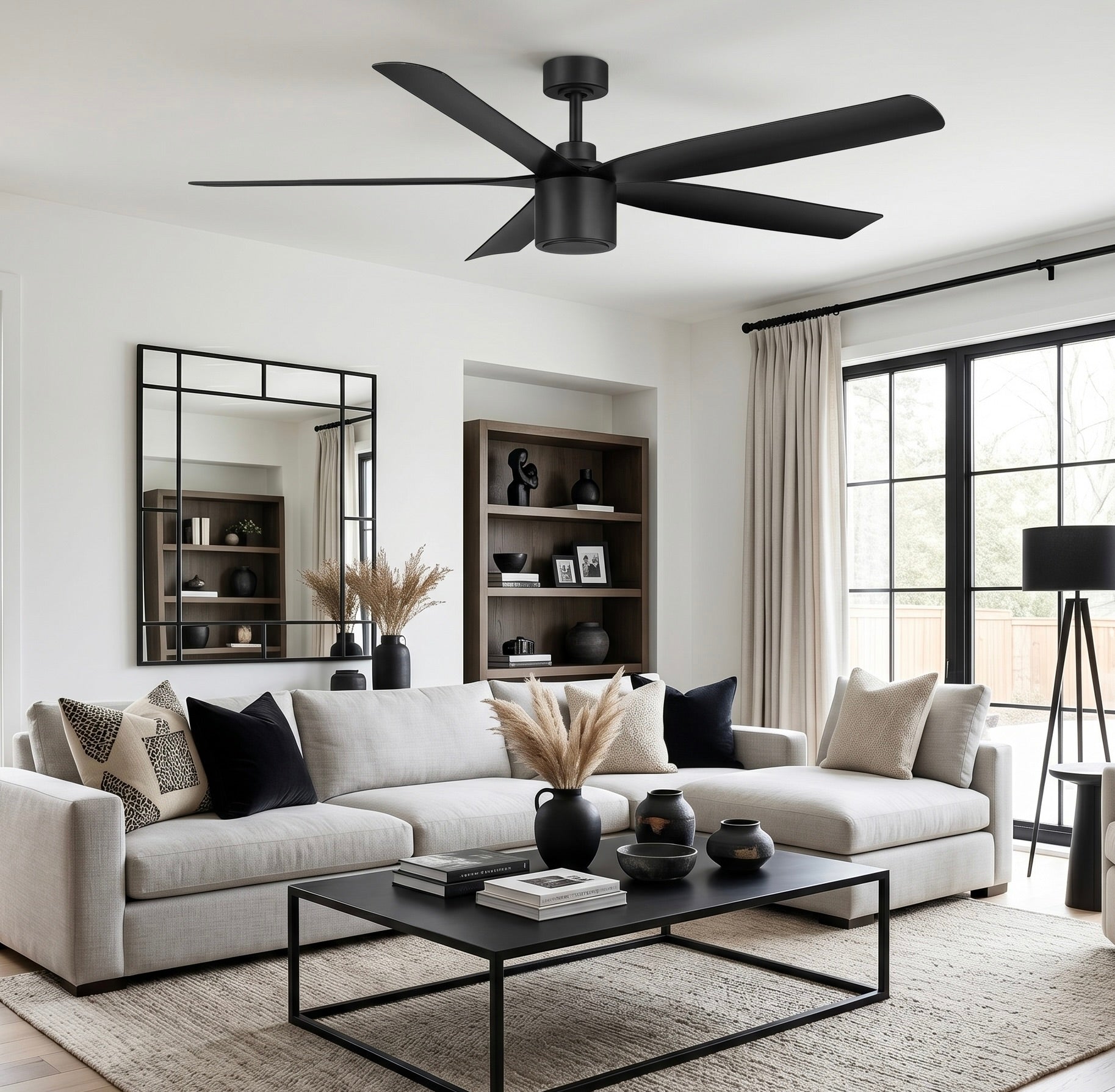 living room featuring RAVIAN® 60" 5-Blade Ceiling Fan in matte black