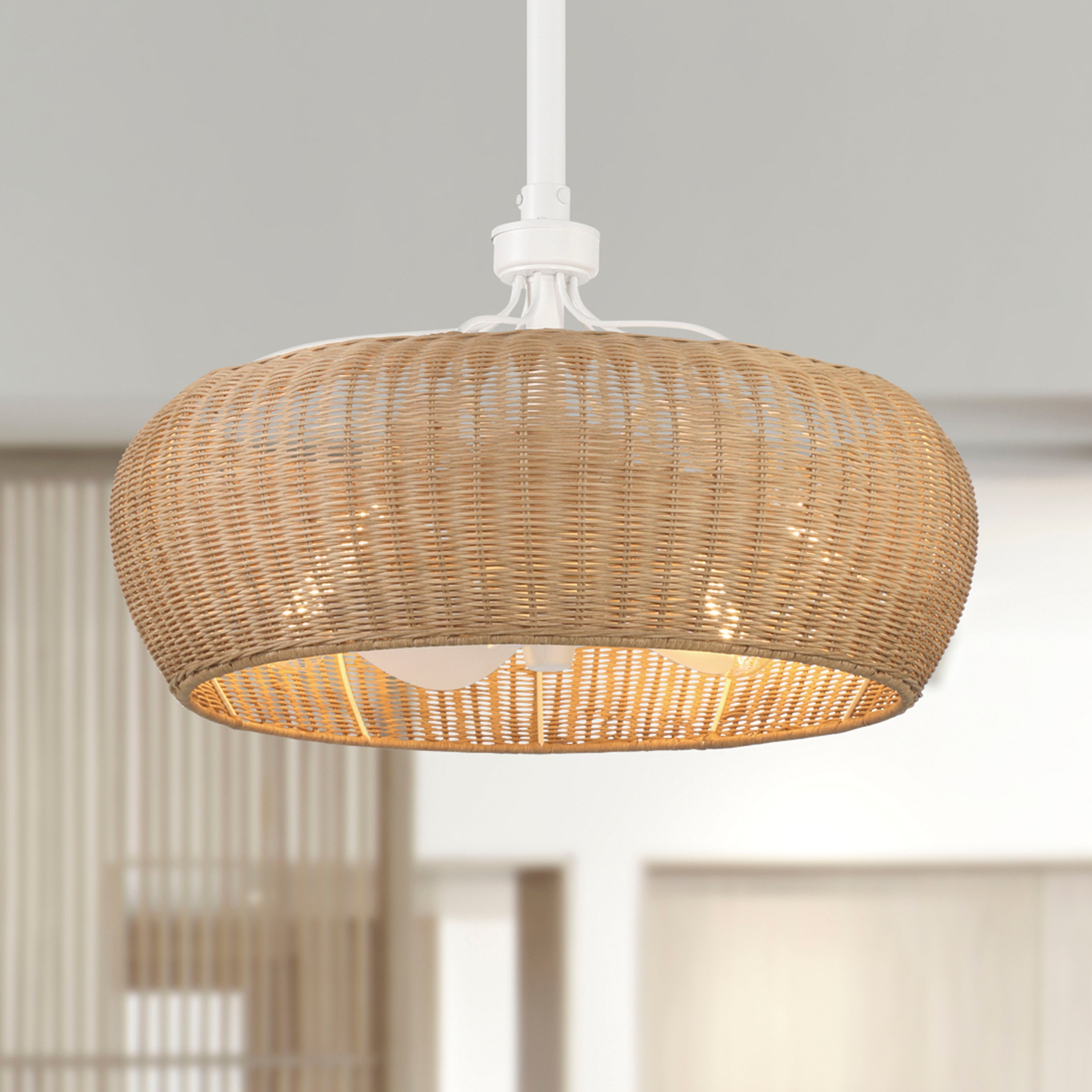 A 22 inch rattan shade ceiling fan in a matte white finish with a remote control, featuring natural lines of woven rattan and a white painted steel frame.