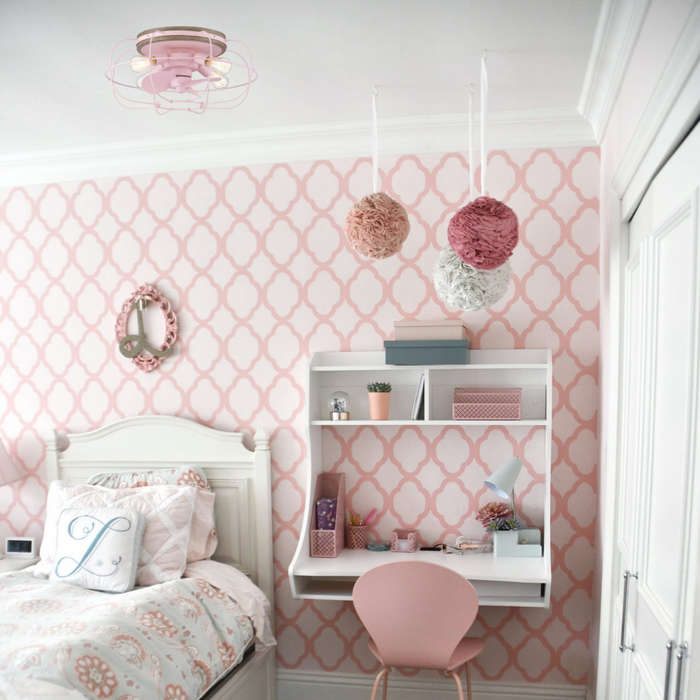 Bedroom with pink design and pictured with an Arranmore pink fan overhanging a living room bed. 