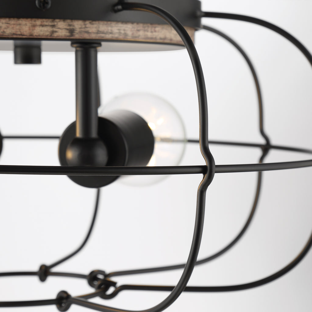 An aged bronze pendant light with a round shade and a chain for hanging.