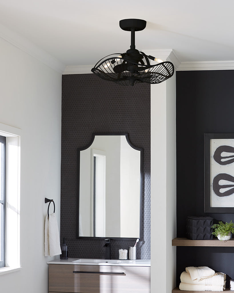 Caged ceiling fan with lights in a black finish hanging in a bathroom.