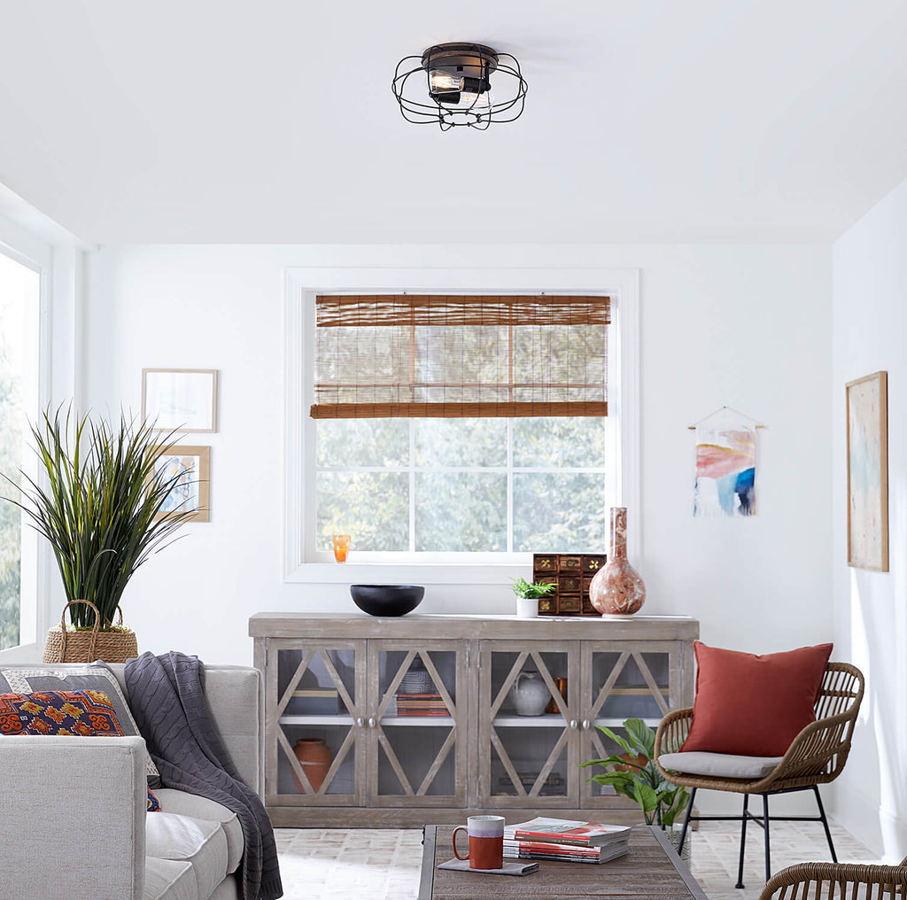 Ceiling fan with a caged design flush mounted in a living room with modern decor.